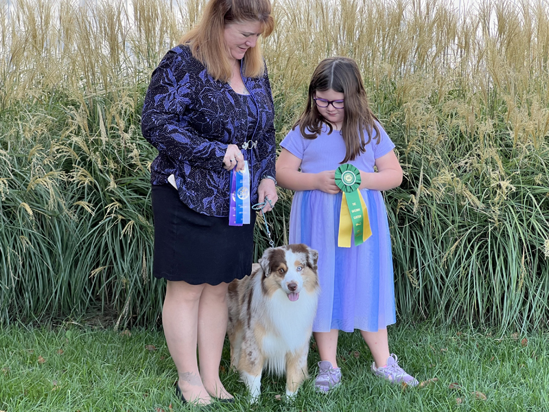 CH Crimson’s Blaze of Glory AX AXJ DCAT HIC with his handlers. CH Crimson’s Blaze of Glory AX AXJ DCAT HIC with his handlers.